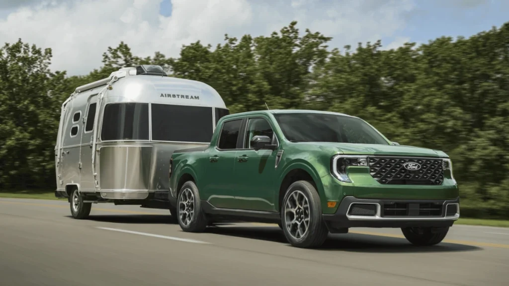 2025 Ford Maverick® towing a camper trailer, showcasing its capability and rugged design in Cleveland, OH.