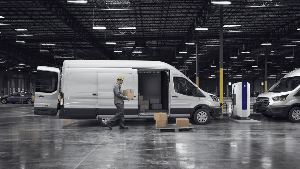 2025 Ford E-Transit van in a warehouse setting, ideal for Cleveland businesses seeking efficient commercial transport.