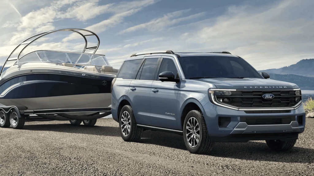 2025 Ford Expedition Platinum towing a boat, built for family road trips across Cleveland highways.