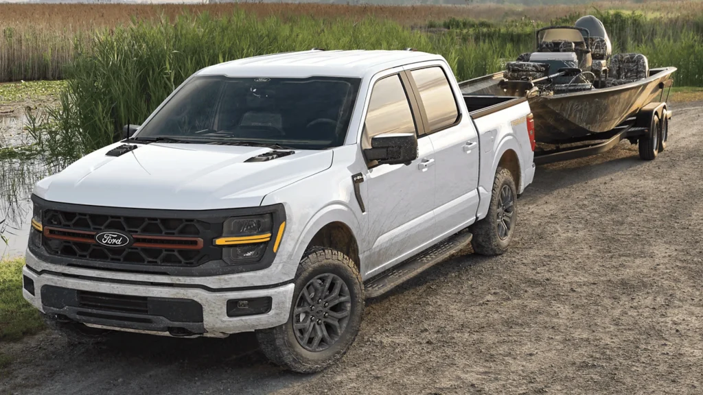 2025 Ford F-150 pickup truck towing a boat, showcasing why it's a favorite for Cleveland adventures.