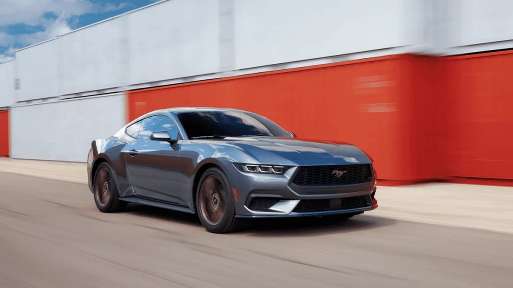 2025 Ford Mustang® speeding along a city route, showcasing track-ready suspension and sharp handling praised by Euclid drivers.