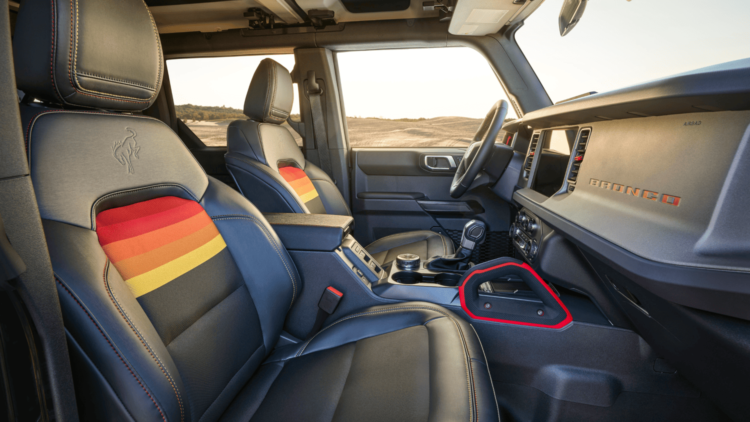 Interior view of front seats with retro-colored stitching in the 2025 Ford Bronco® in Euclid, OH.