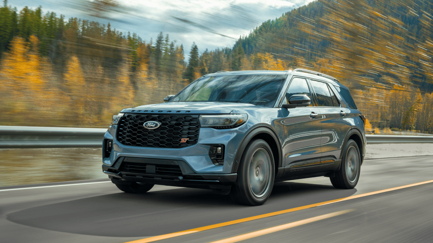 2025 Ford Explorer® ST in motion through autumn roads near Euclid, OH, featuring sporty design and black grille.