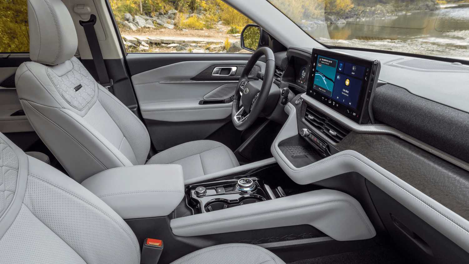 Interior front cabin of the 2025 Ford Explorer® Platinum in Euclid, OH, showcasing its premium touchscreen and quilted seats.
