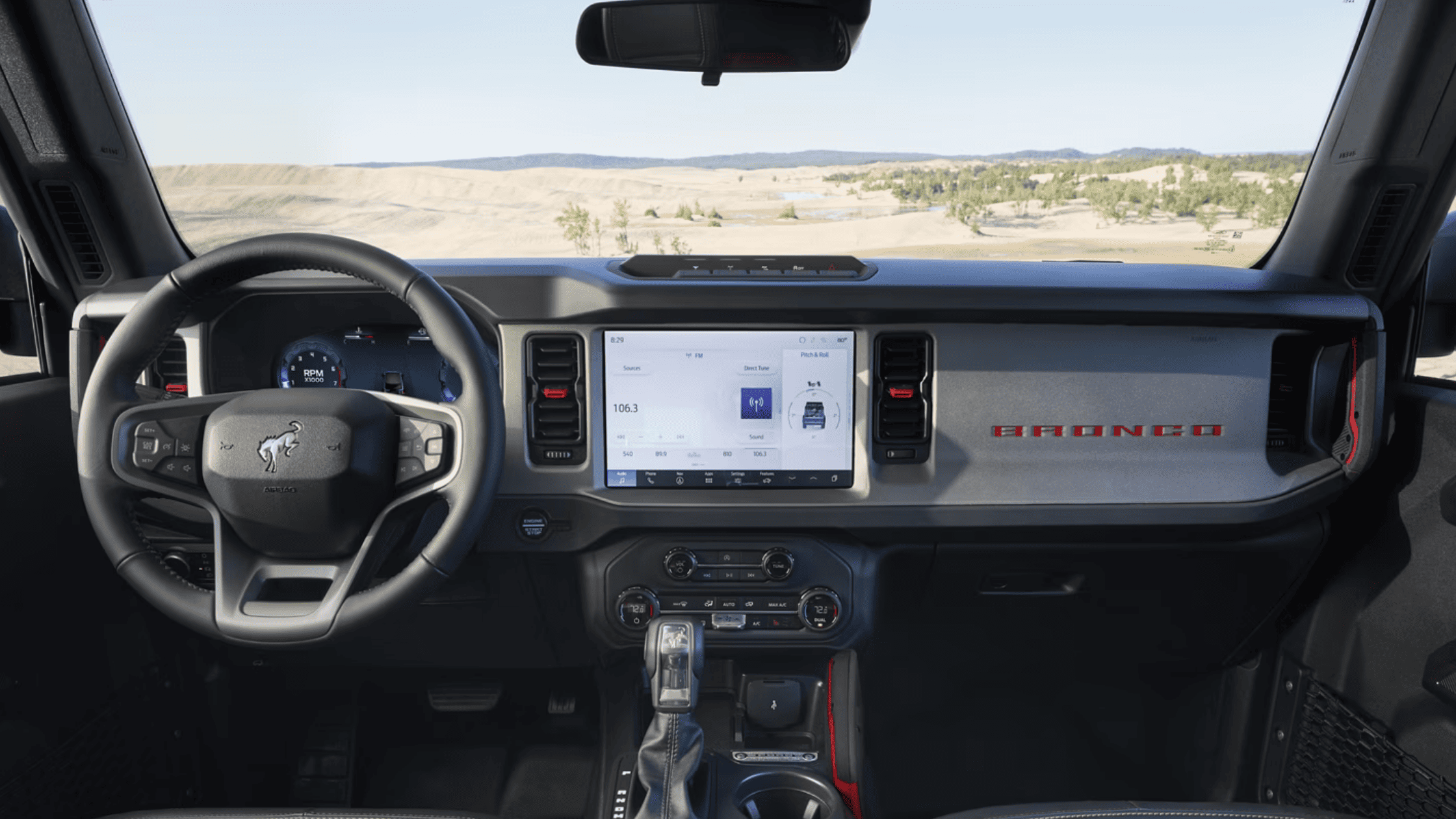 Inside the 2025 Ford Bronco® in Cleveland, OH, featuring a sleek dashboard and comfortable seating arrangement.