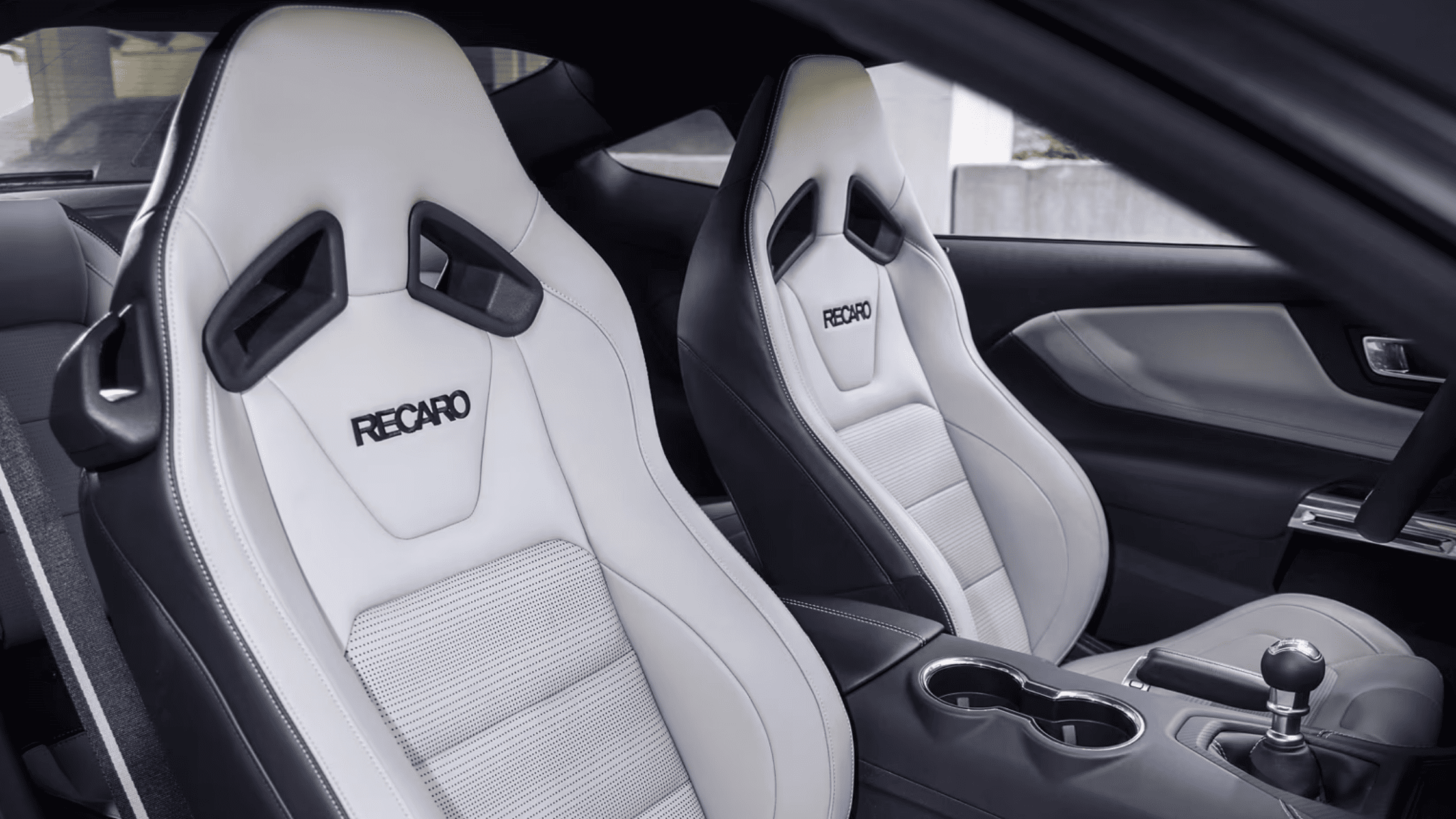 Interior view of a 2025 Ford Mustang® in Cleveland, OH, featuring sleek white and black sports car seats.