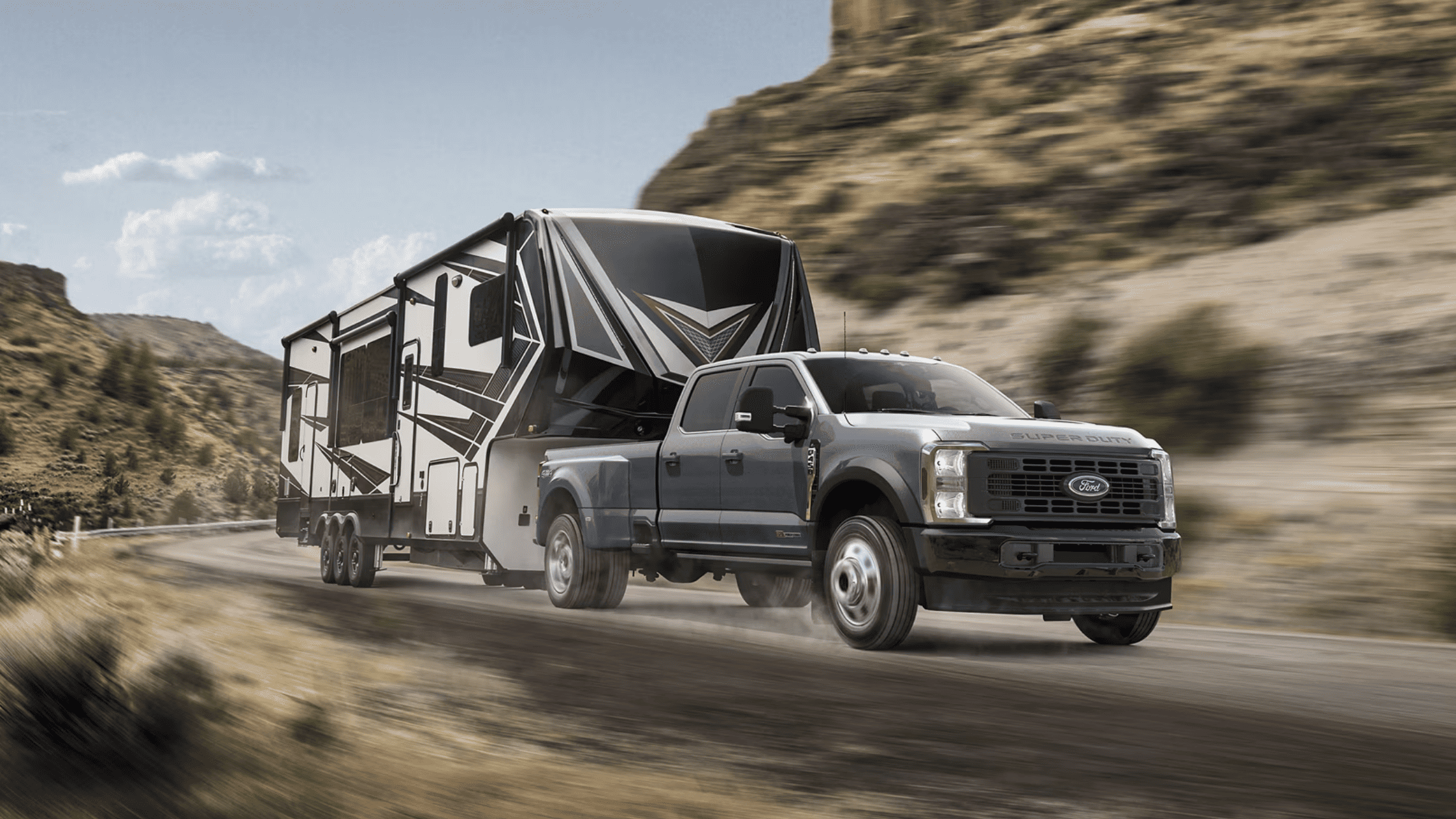 2025 Ford Super Duty® F-350® towing a trailer, showcasing its power and capability in Cleveland, OH.