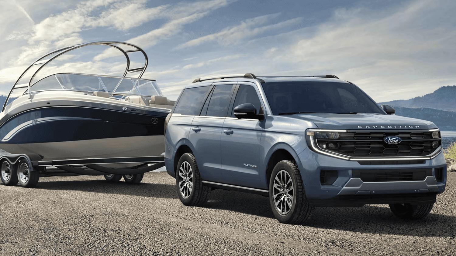 A 2025 Ford Expedition® Platinum towing a large boat along scenic roads near Euclid, OH.
