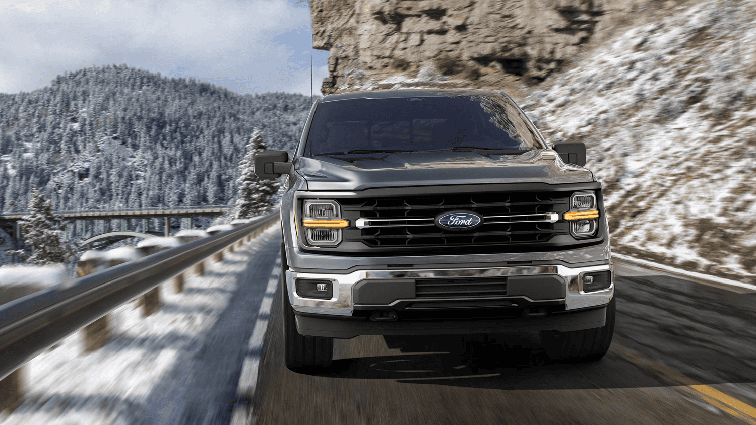 The 2025 Ford F-150® driving through snowy mountain roads near Euclid, OH, highlighting its rugged capability.