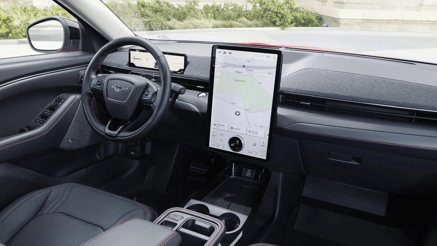 Interior of the 2025 Ford Mustang Mach-E® with a large vertical touchscreen and modern digital dashboard near Euclid, OH.
